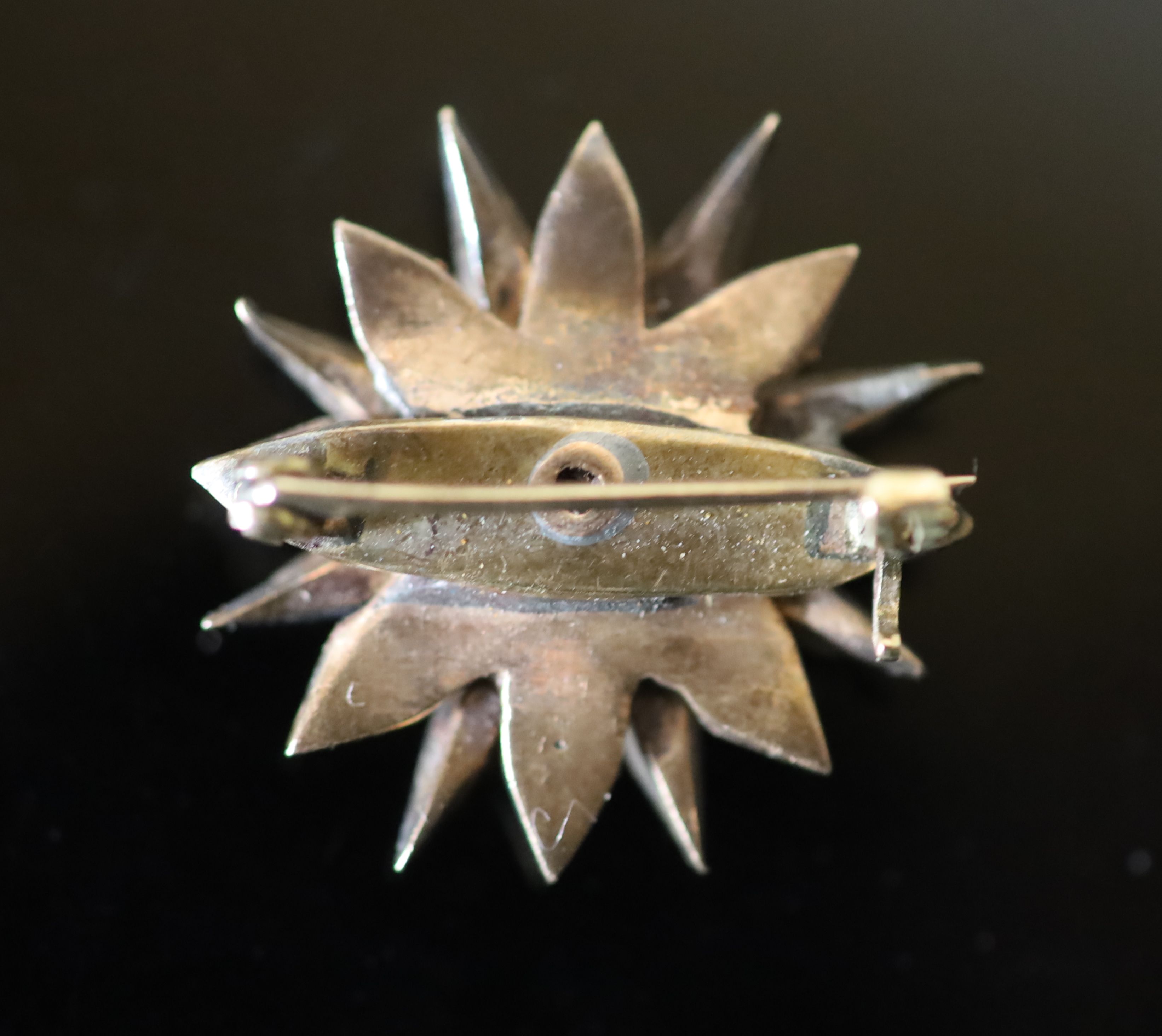 A 19th century French gold and foil backed rose cut diamond set starburst brooch,